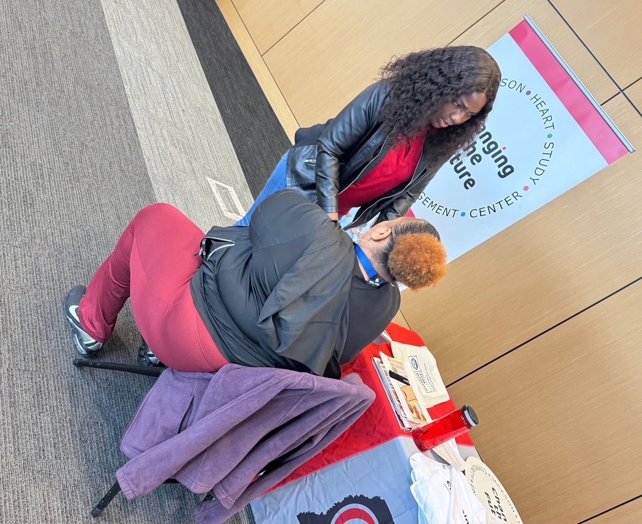 A participant has their blood pressure checked